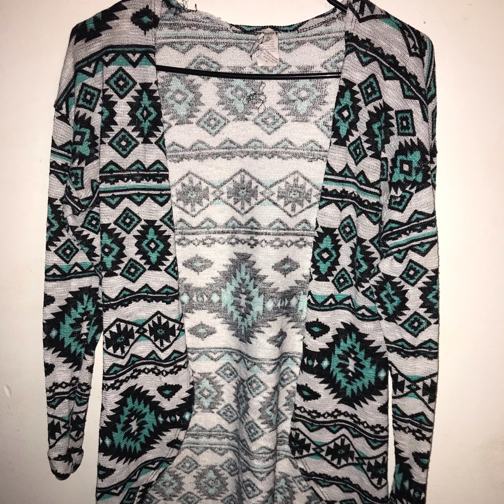 It’s a bird. No its a super cute cardigan!